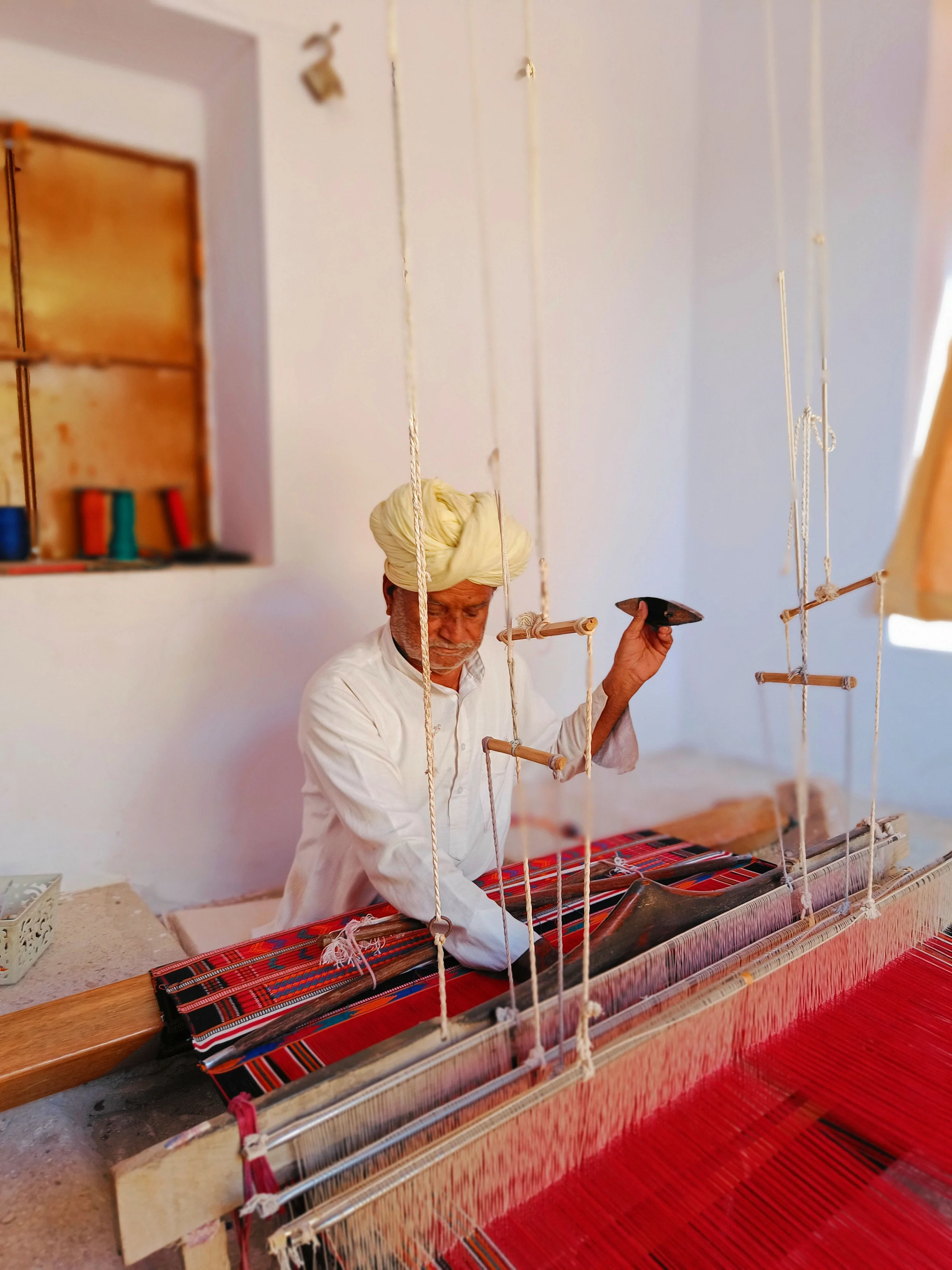 A weaver at the handloom, India